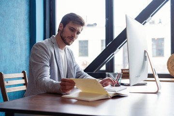 Man Working At Computer In Contemporary Office.