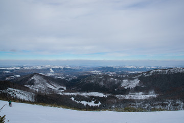 Mountain peaks in Zakopane and in Poland covered with fresh snow in the daytime with blue sky