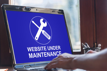Website maintenance concept on a laptop screen