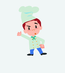 Chef something angry shows something to his right.