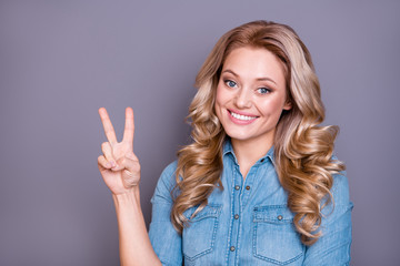 Close-up portrait of her she nice cute sweet lovely fascinating charming attractive cheerful positive optimistic glad wavy-haired lady showing v-sign isolated over gray violet purple pastel background