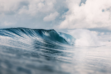 Ocean barrel wave in ocean. Breaking wave for surfing in Tahiti