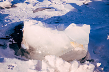 Blocks of ice gleaming in the sun. Arctic winter background.