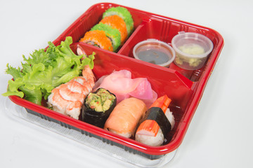 fresh sushi set served in a red plastic box,sushi for take home