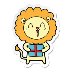 sticker of a laughing lion cartoon with christmas present
