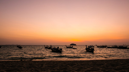 silhouette of a boat at sunset, summer beach landscape