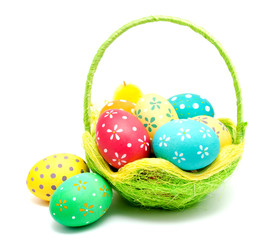 Perfect colorful handmade easter eggs in the basket isolated