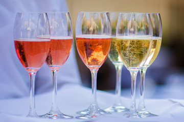 Wine glasses in warm light loft restaurant