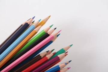 Colour pencils isolated on white background close up 