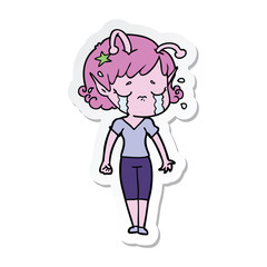 sticker of a cartoon crying alien girl