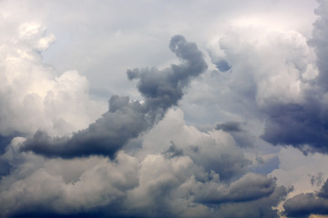 Fototapeta na wymiar Gray rainy sky with big clouds. Nature background.