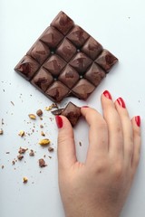 chocolate bitten in hand 