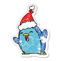christmas distressed sticker cartoon of kawaii penguin