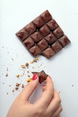 chocolate bitten in hand 