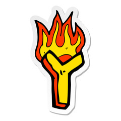 sticker of a cartoon flaming letter
