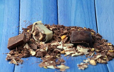 cocoa and milky chocolates on the blue floor