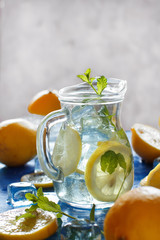Homemade refreshing drink with lemon juice and mint