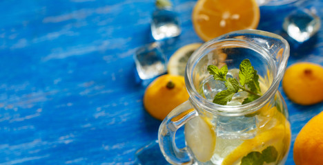 Homemade refreshing drink with lemon juice and mint