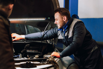 The guy works on auto service