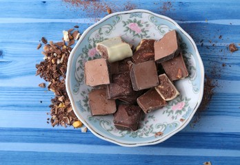 cocoa and milky chocolates on the blue floor