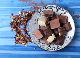 cocoa and milky chocolates on the blue floor