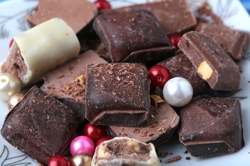 cocoa and milky chocolates on the blue floor