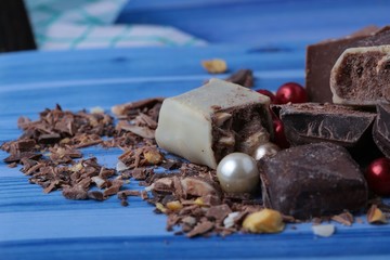cocoa and milky chocolates on the blue floor