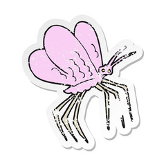 retro distressed sticker of a cartoon butterfly