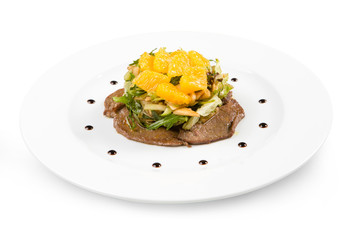 Salad with beef on a white plate