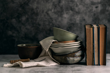 Still life with Japanese hand crafted ceramic with old cookbook