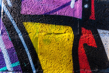 Background with painted wall texture with bright colors and funny graffiti.