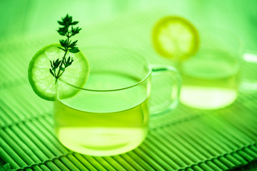 A cup of green tea with mint