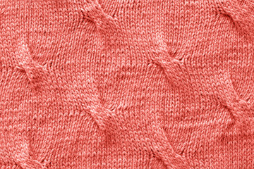 Knitted Jersey fabric textile trendy toned coral color of the year 2019, background, texture