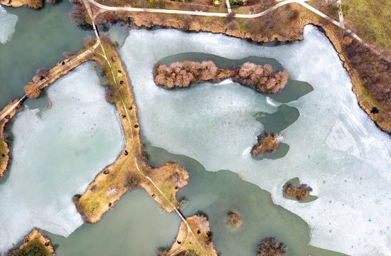 Frozen lake from above in Sarvar Hungary