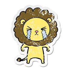 distressed sticker of a cartoon crying lion