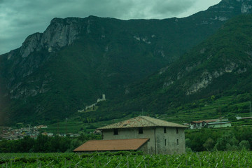 Fototapeta premium Italy,La Spezia to Kasltelruth train, a house with a mountain in the background