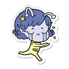 sticker of a cartoon crying alien girl