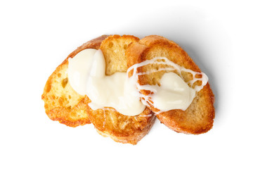 French toasts with condensed milk isolated on white background. 