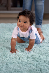 Cute baby learning to crawl