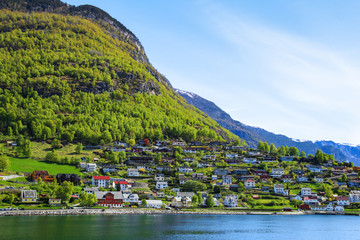 Fototapeta premium The village of Aurlandsvangen at the coast of the Sogne fjord (Aurlands fjord)