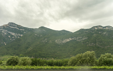 Italy,La Spezia to Kasltelruth train, a wineyard with a mountain in the background