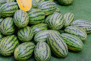 Green watermelon in a market waiting for sale. Fruit watermelon background