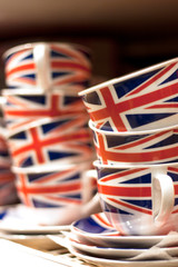 Two stacks of  Union Jack British Flag tea cups with matching saucers