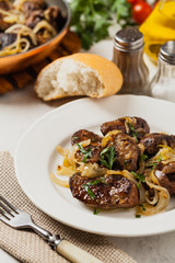 Fried chicken liver with onions.
