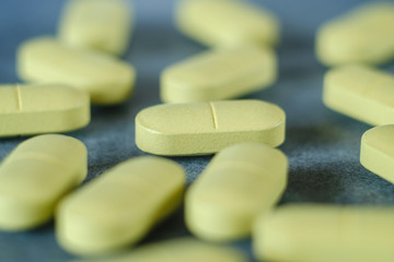 Macro shot of light green pills.