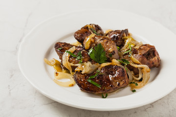 Fried chicken liver with onions.