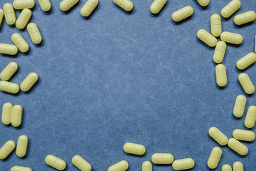 Capsule pills pattern on a dark background. Place under the text