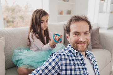 Fototapeta premium Close up photo little she her girl glad he him his father hair try hard make daddy best cool coiffure glad to be useful sunday homey wear jeans denim checkered plaid shirt house sit cozy divan