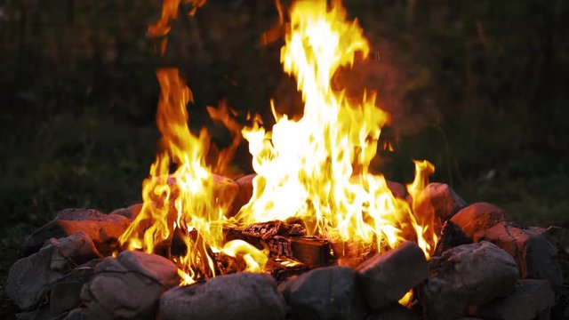UHD graded 60 fps shot of the burning campfire