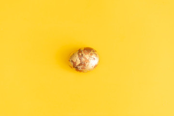 stone on yellow background